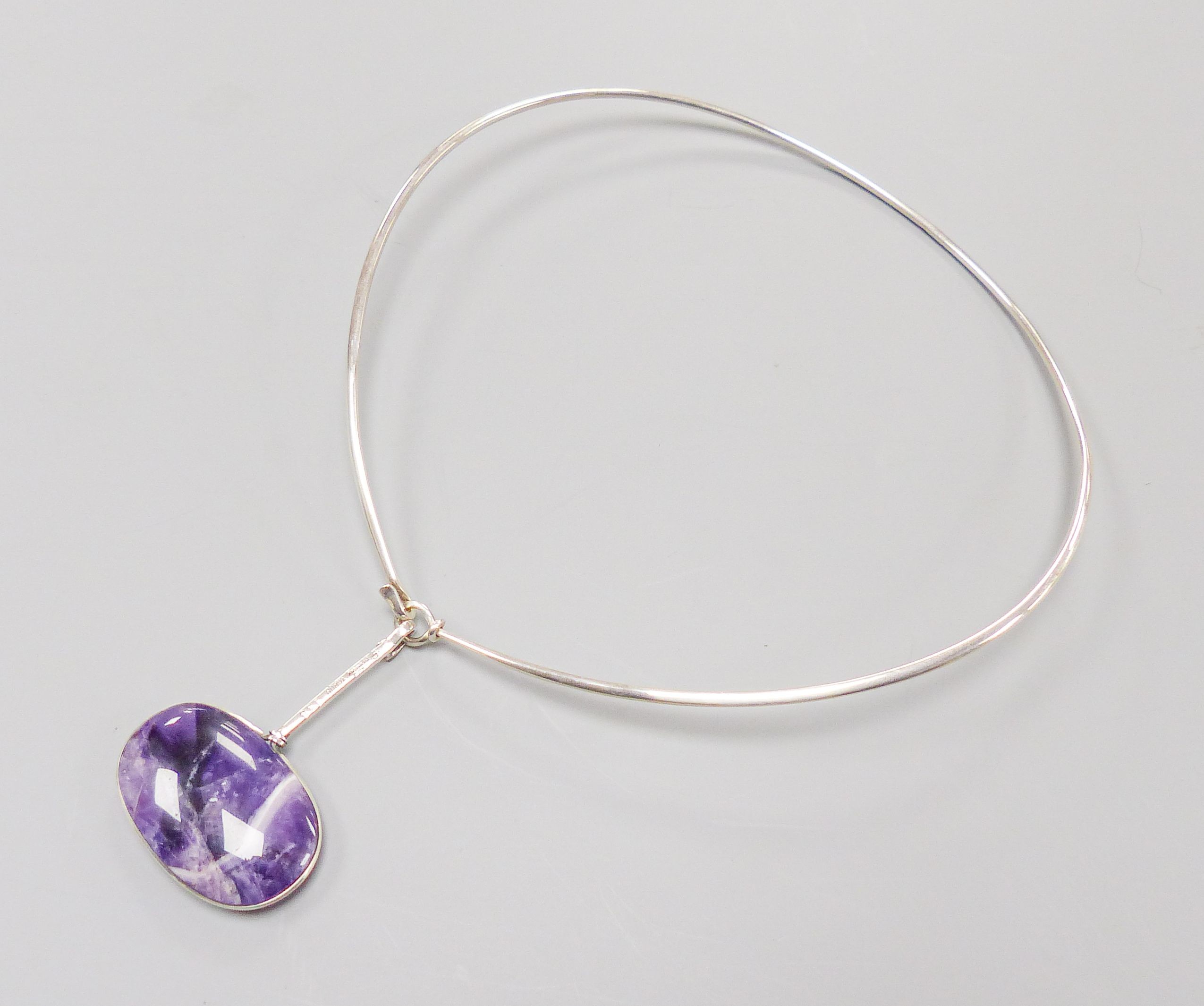 A Torun for Georg Jensen sterling and amethyst quartz set pendant, no. 133, 64mm, on a Torun for Georg Jensen sterling necklet, no. 174.